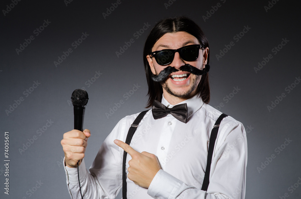 Funny singer with microphone at the concert Funny singer with microphone at the concert