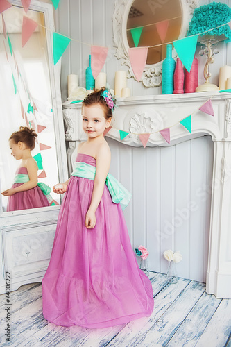 Beautiful little girl in a pink dress