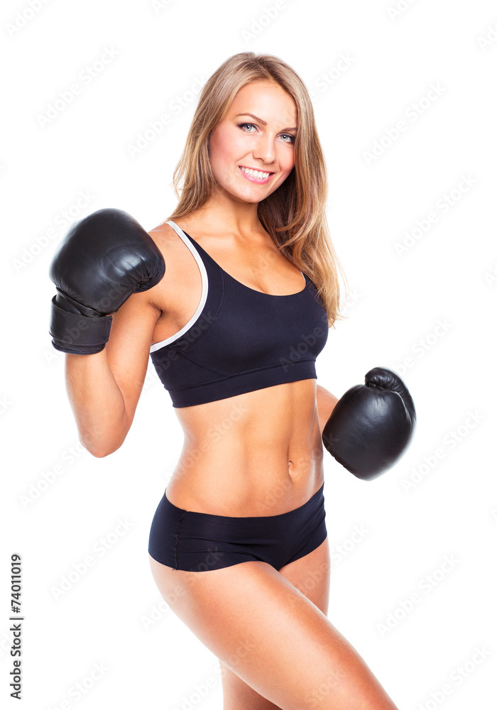 Young athletic woman in boxing gloves on a white Young athletic woman in boxing gloves on a white