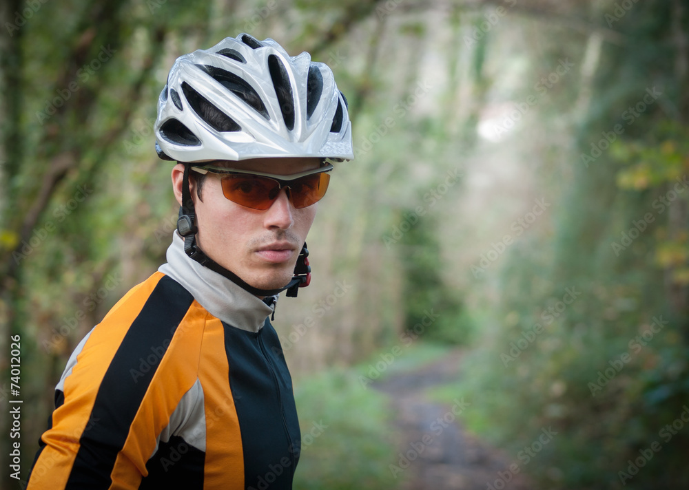 Cyclist portrait in the forest Cyclist portrait in the forest