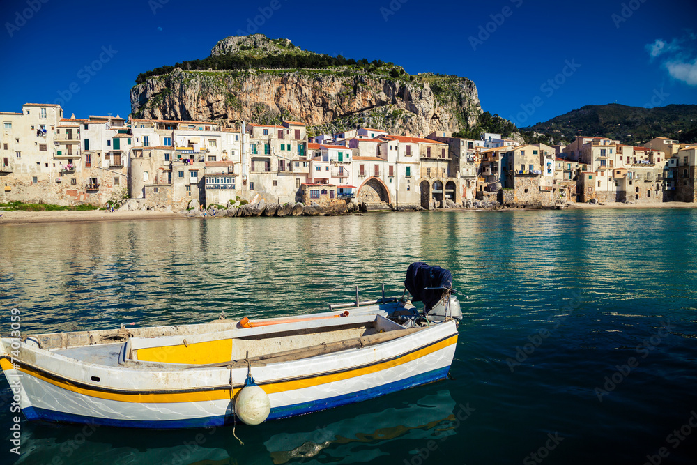 old boat drifting in a Cefalu harbor