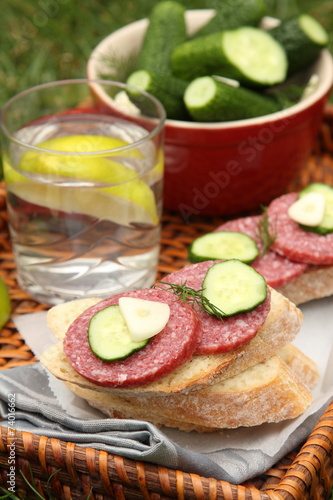 Sandwiches with smoked sausage and homemade salted cucumbers