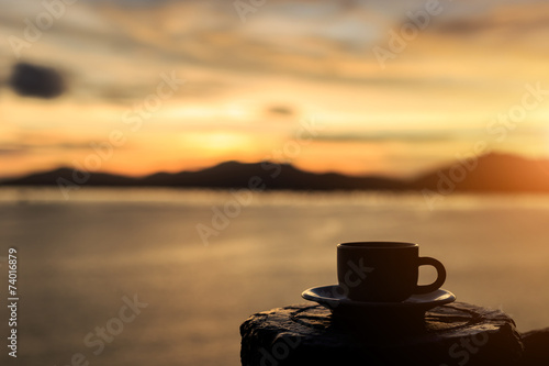 Coffee cup and sunset © SKT Studio