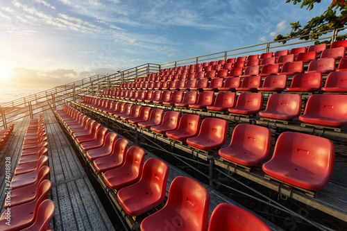 Empty plastic chairs at temporary grandstand stadium in Phuket,