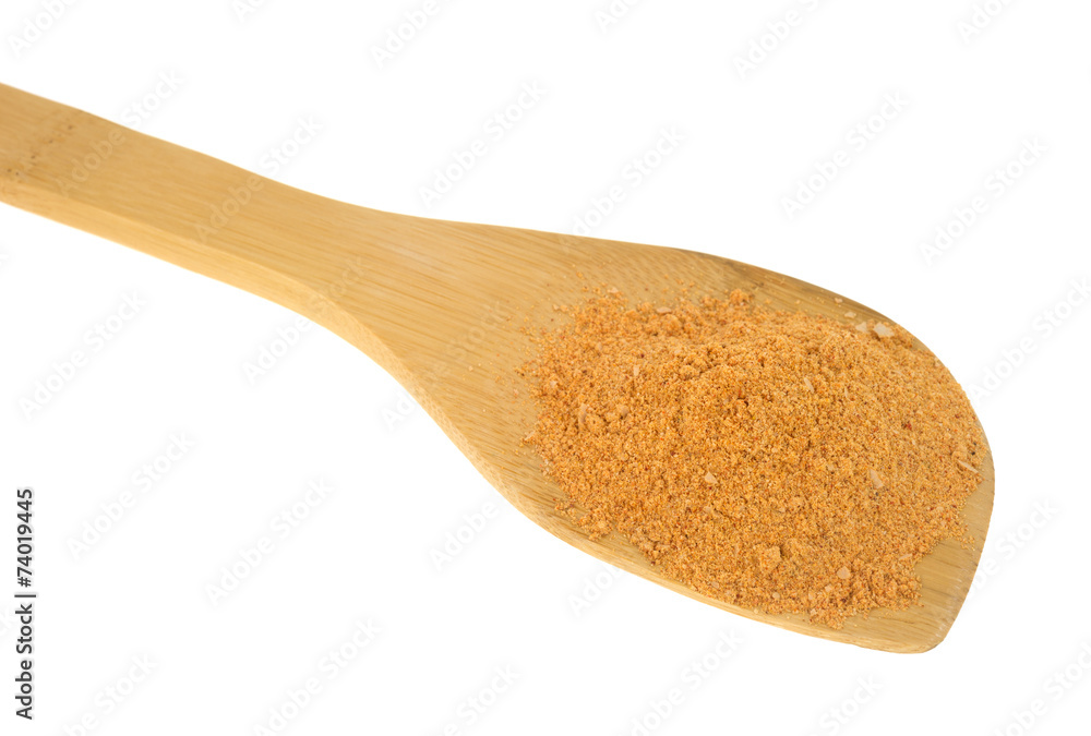 Portion of taco seasoning on a wood spoon Portion of taco seasoning on a wood spoon