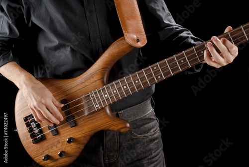 playing bass guitar