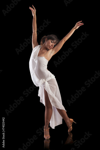 elegant beautiful woman latin dancer performing on black backgro