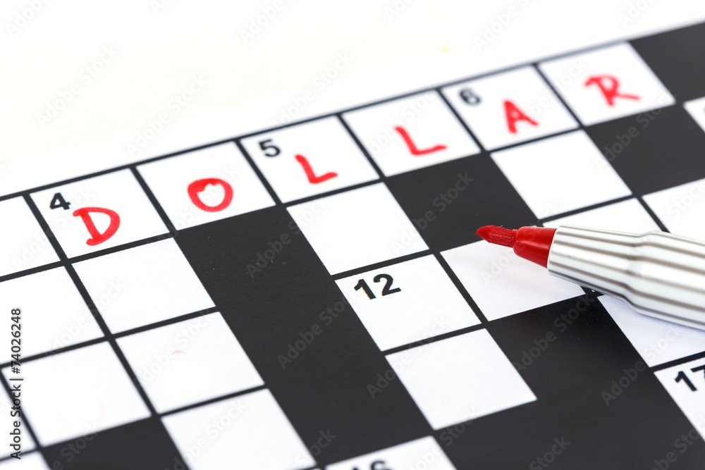 Close up red marker on Crossword - Dollar Close up red marker on Crossword - Dollar