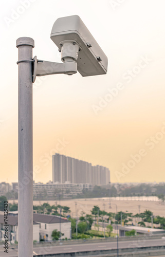 Security CCTV camera on road in city