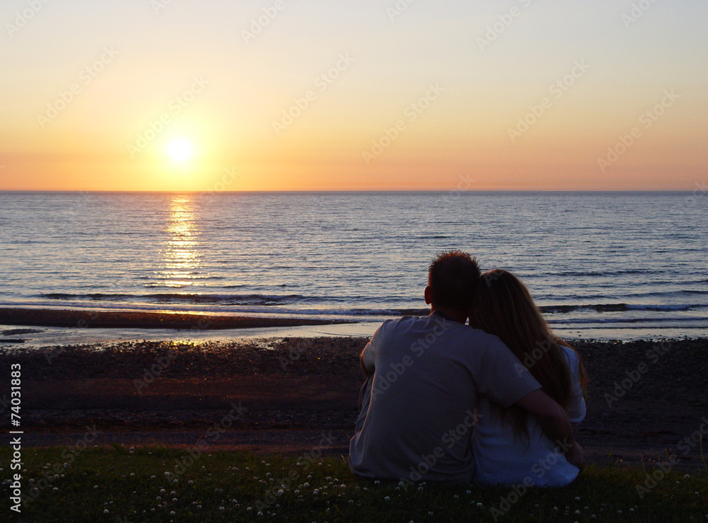 Young couple watching the sunset
