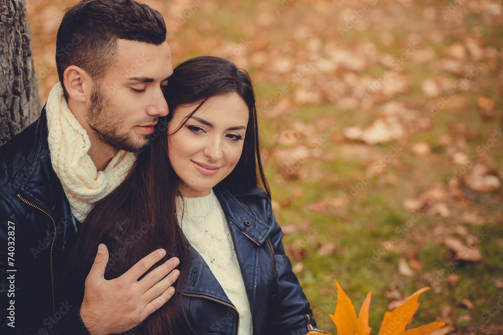 Fototapeta premium Young couple in autumn park