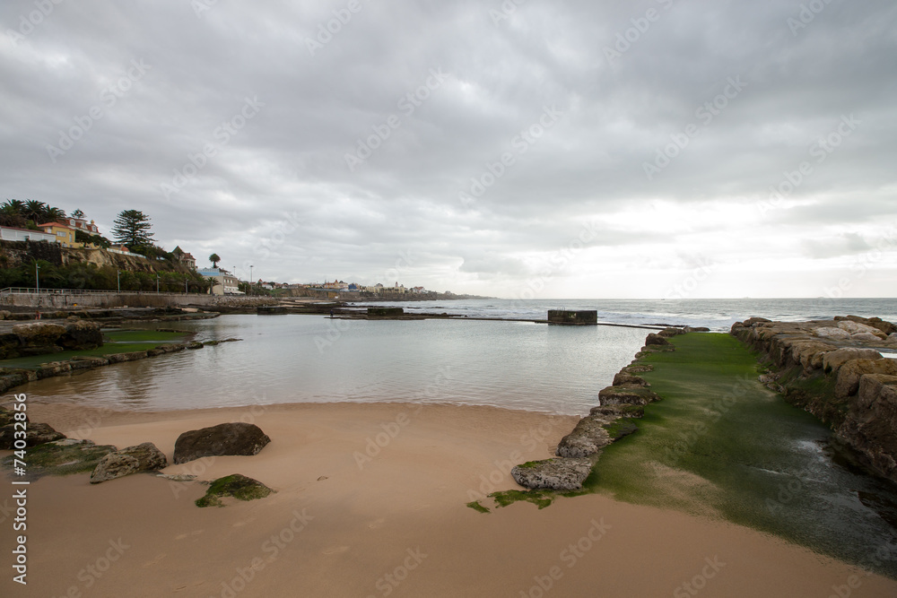 Cascais embankment at low tide. dramatically Cascais embankment at low tide. dramatically