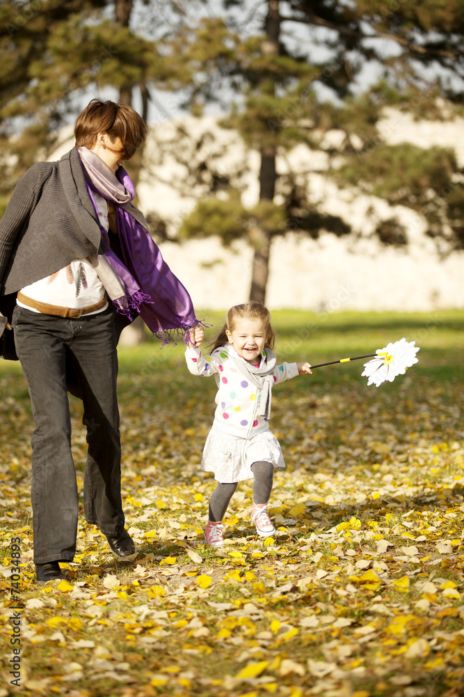 Happy Family Portrait Mother And Daughter Outdoor With Daisy Happy Family Portrait Mother And Daughter Outdoor With Daisy