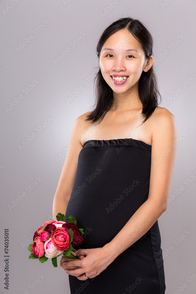 Asian pregnant mother hold with flower Asian pregnant mother hold with flower