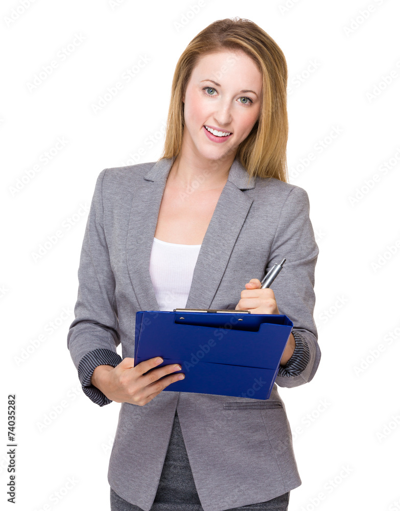 Caucasian Businesswoman write on clipboard Caucasian Businesswoman write on clipboard
