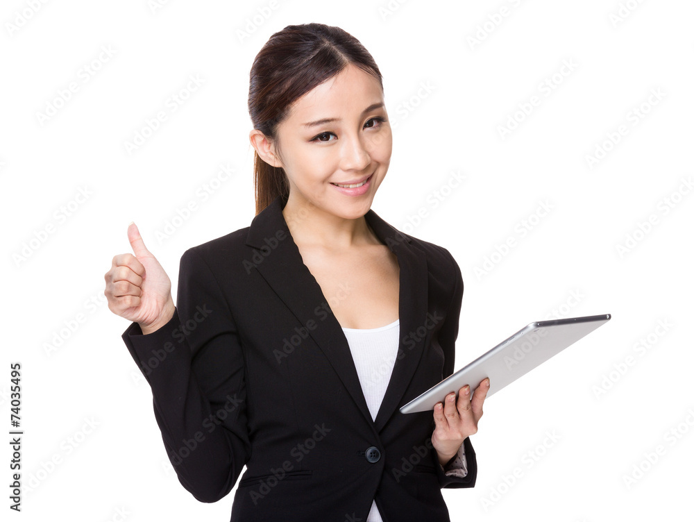 Businesswoman use of tablet and thumb up Businesswoman use of tablet and thumb up
