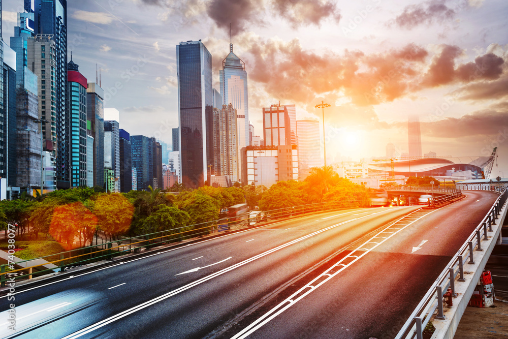 cityscape and traffic trails on the road of modern city