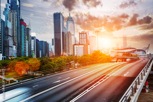 cityscape and traffic trails on the road of modern city