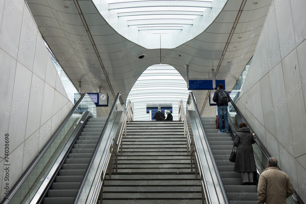 People standing on escalator People standing on escalator