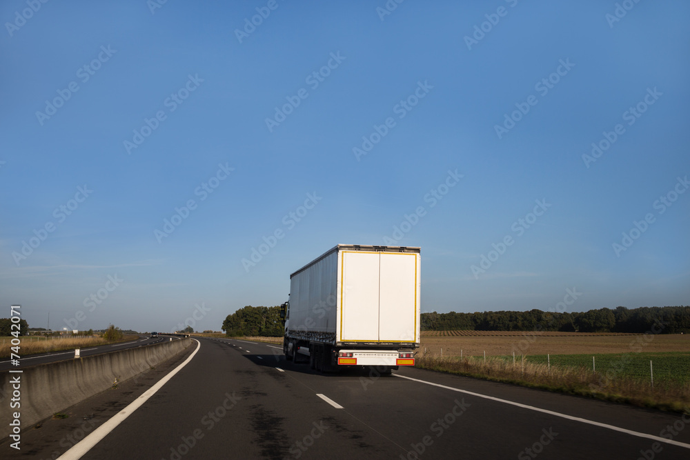 White truck on an open road