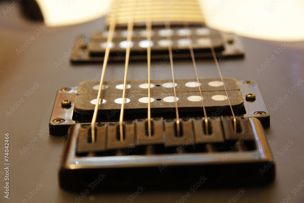Black electric guitar isolated on the white backgriund Black electric guitar isolated on the white backgriund