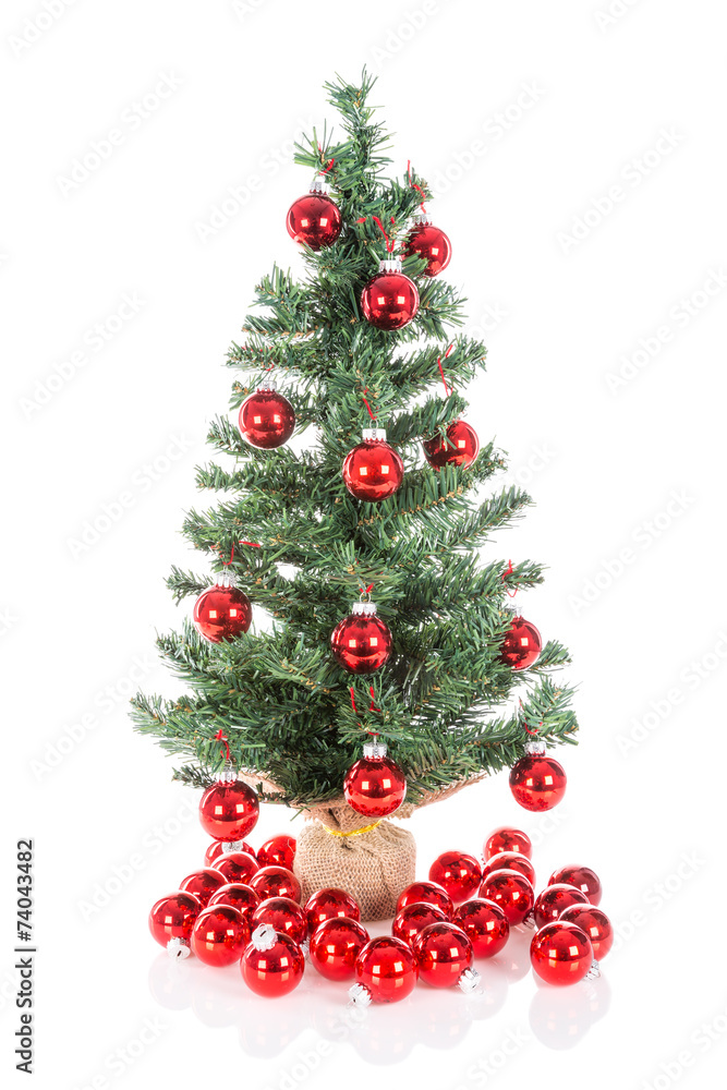 Christmas tree decorated with red balls isolated at white Christmas tree decorated with red balls isolated at white
