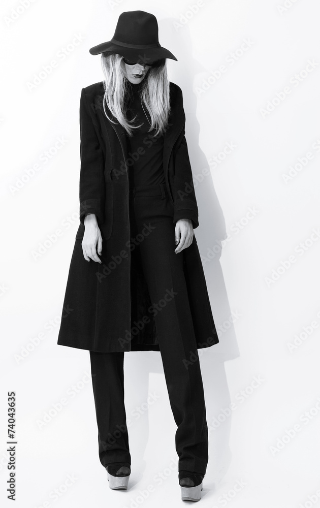 Fashion Black and white photo. Glamorous blonde in classic coat Fashion Black and white photo. Glamorous blonde in classic coat