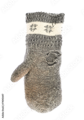 Old gray frayed mitten isolated