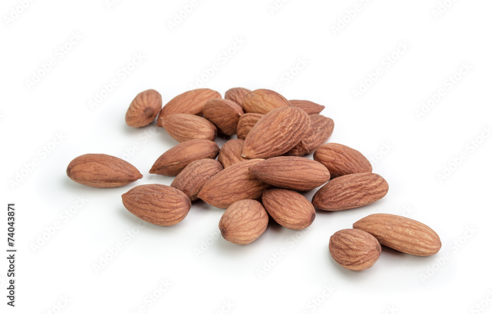 Heap of almond nuts isolated on white background Heap of almond nuts isolated on white background