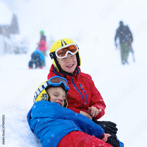 Two brothers enjoying winter ski vacation