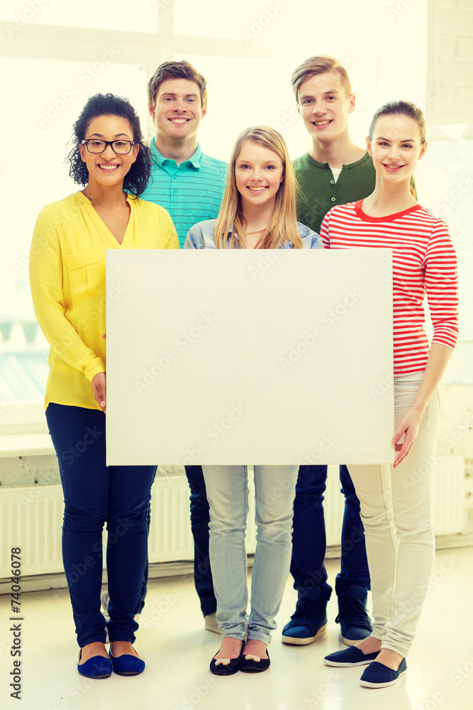 smiling students with white blank board at school smiling students with white blank board at school
