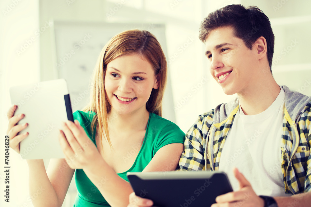 smiling students with tablet pc at school smiling students with tablet pc at school