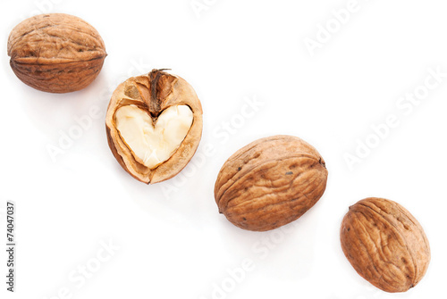 Heart in walnut on white background