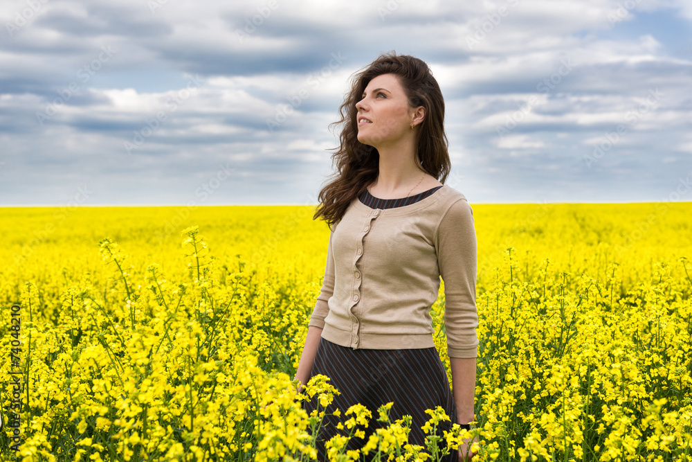 woman portrait in yellow flower field woman portrait in yellow flower field
