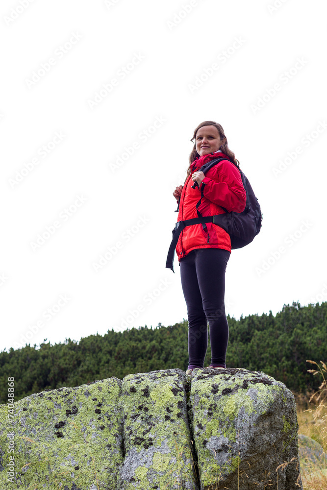 Portrait of happy young female hiker smiling
