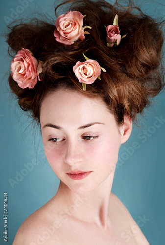 Artistic portrait of young caucasian girl with big hairstyle