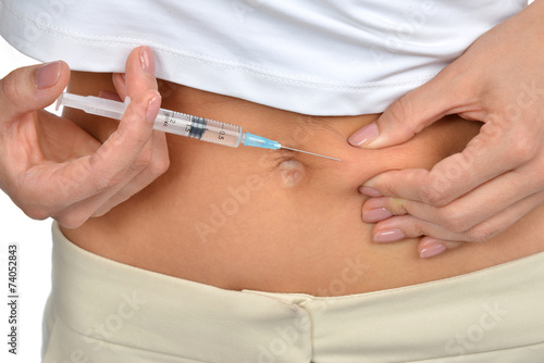 Diabetes patient insulin shot by syringe with dose of medicine