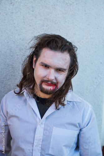 A young man in the image of the vampire Count Dracula photo