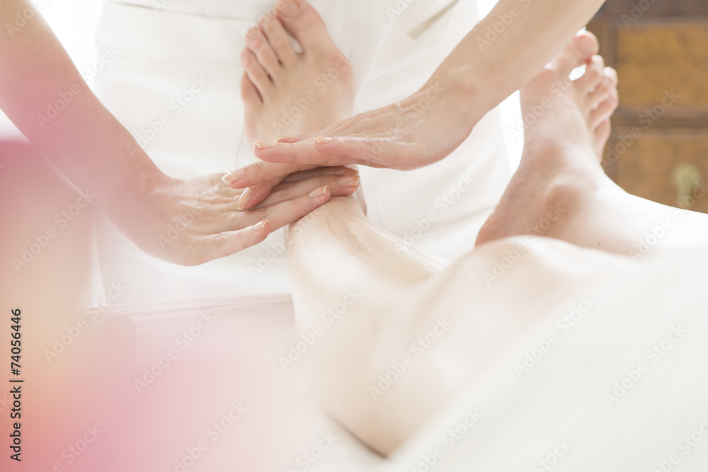 Fototapeta premium Esthetician for a woman of foot massage