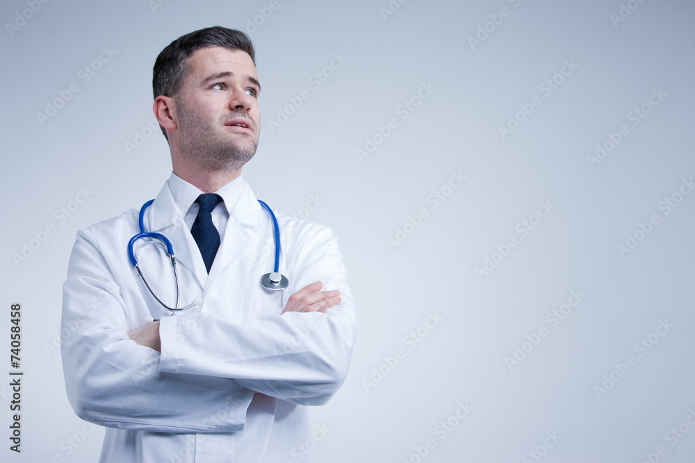 doctor looking up thinking or worried doctor looking up thinking or worried
