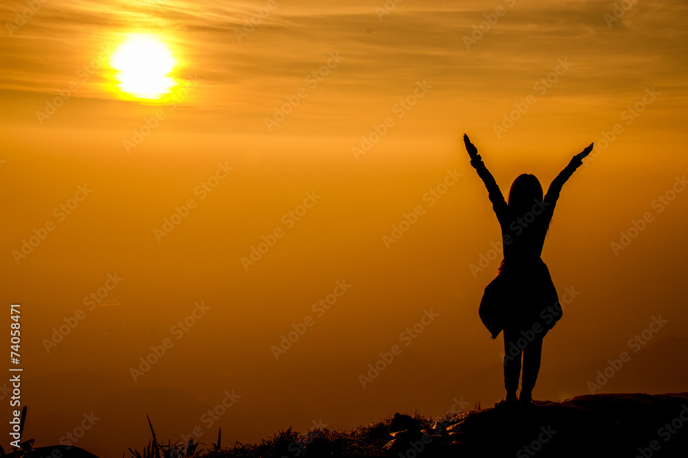 The success concept of silhouette of Young woman standing arms m