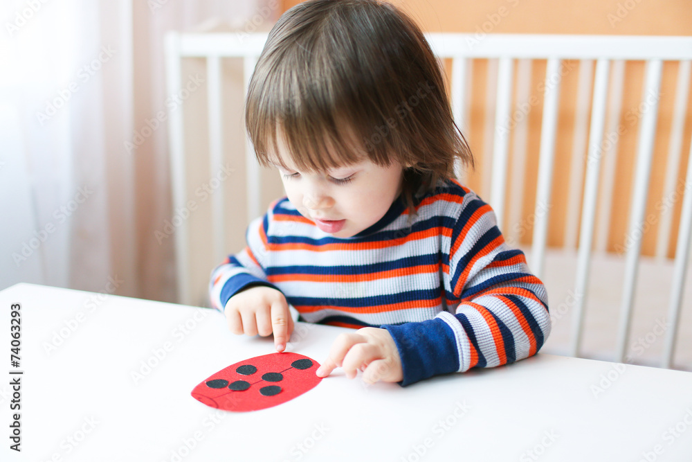 Lovely little boy made paper ladybug Lovely little boy made paper ladybug
