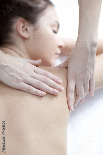 Young woman getting a massage in a spa 