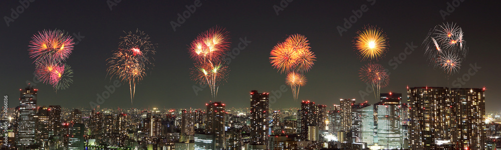 Fototapeta premium Fireworks celebrating over Tokyo cityscape at night