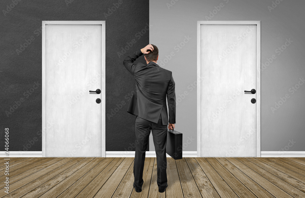 Fototapeta premium man standing in front of doors / Black / White