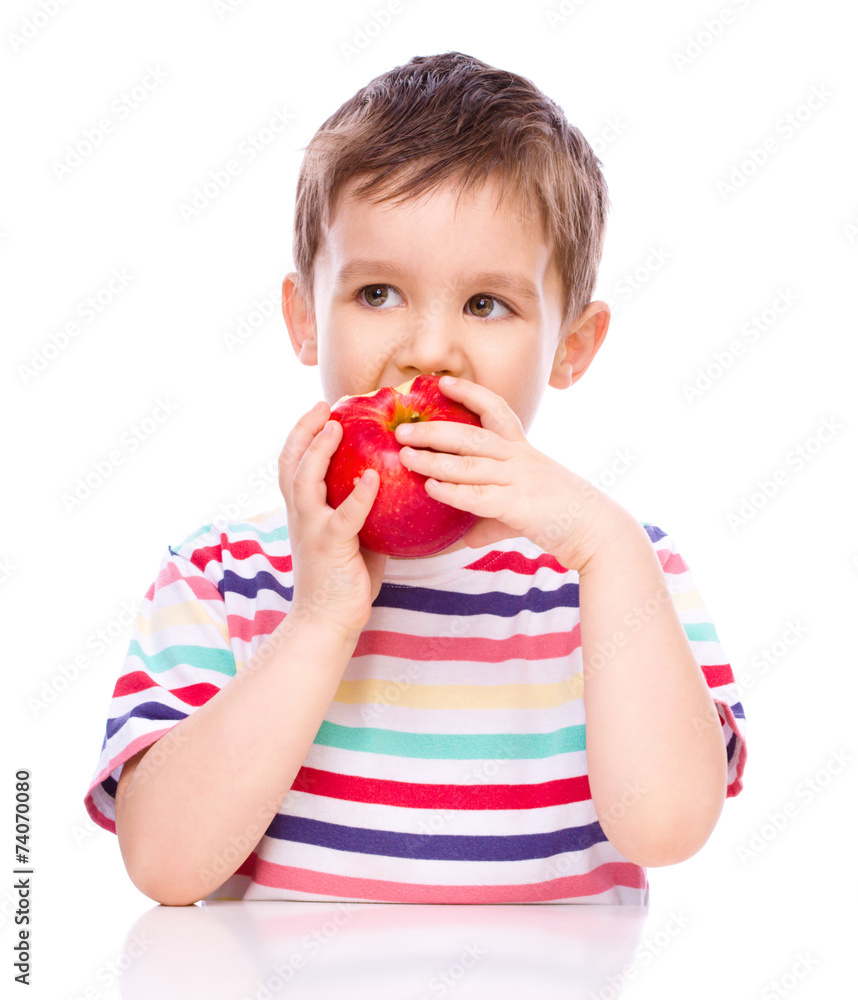 Cute boy with red apples Cute boy with red apples