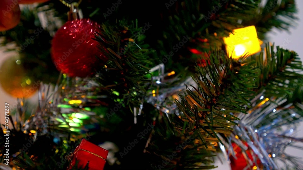 Hand Hanging Decorative Toy Ball on Christmas Tree Branch. Hand Hanging Decorative Toy Ball on Christmas Tree Branch.