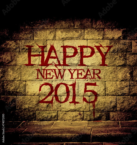 happy new year 2015 blood text at the brick wall with dim light
