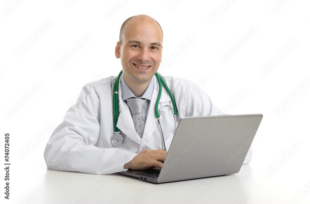 handsome doktor sitting at a desk with laptop handsome doktor sitting at a desk with laptop