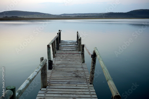 jetty leading into a tranquil river